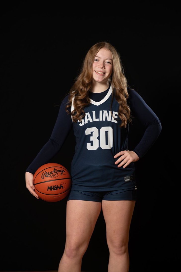 Saline basketball player portrait with ball